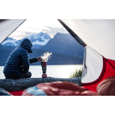 MSR WindBurner Personal Stove System black in action by the lake